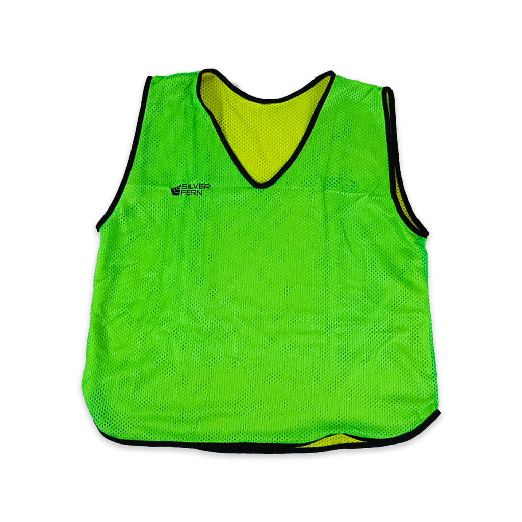 Green sports bib with black trim on a white background