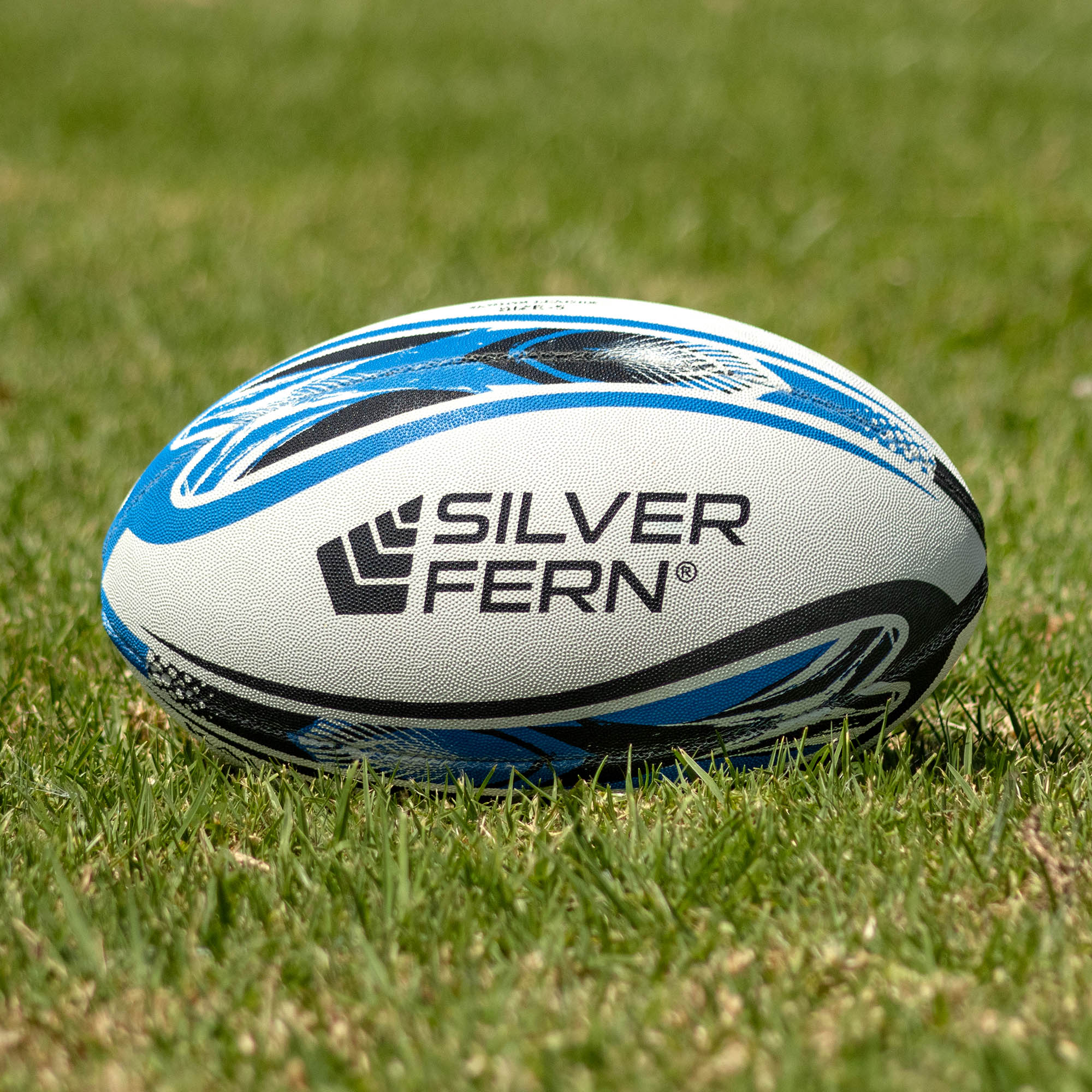 Silver Fern League Kauri Match Size 5, Lifestyle shot, sitting on a rugby field
