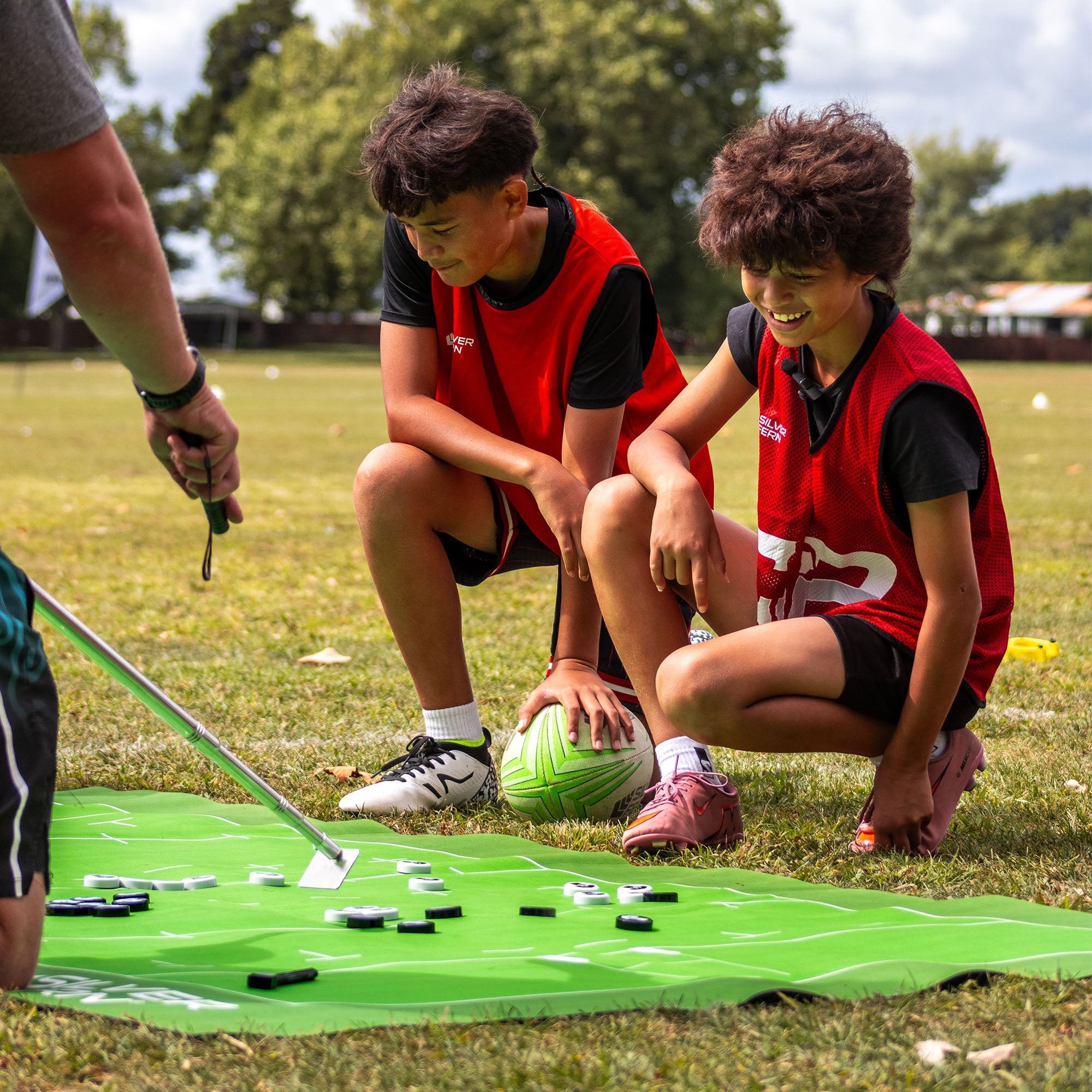 Silver Fern Rugby Union Coaching Mat, lifestyle shot, coach walking players through strategy