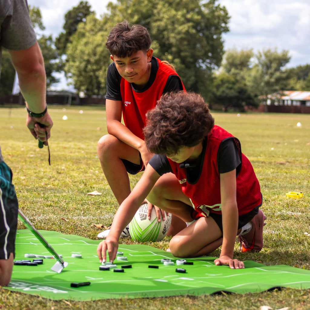 Silver Fern Rugby Union Coaching Mat, lifestyle shot, coach walking players through strategy